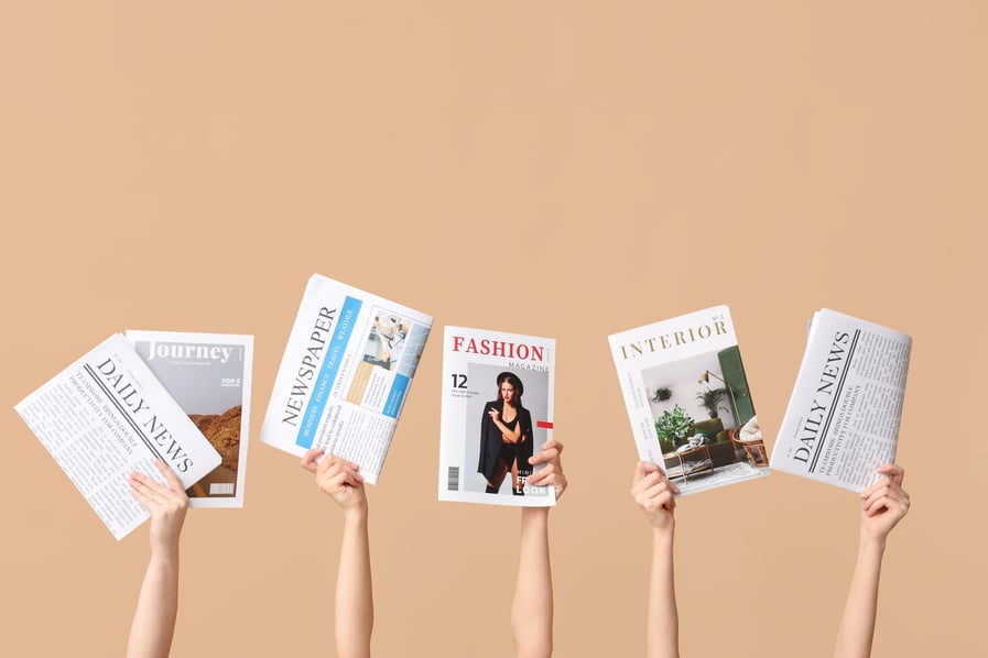 Hands that are holding up magazines